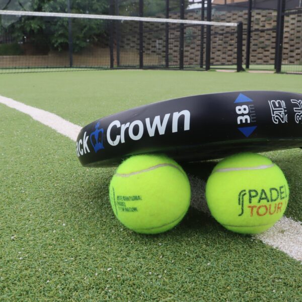2 padel balls and a racket