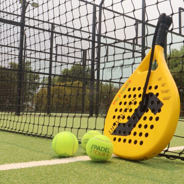 padel racket with 3 tennis balls